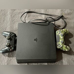 PS4 Sony Console with a Black and Camouflage Controller